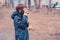 Boy speaks on a mobile phone in the Park.