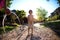 Boy splashed with water from a hose in the courtyard of the house on a hot sunny day