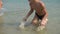 Boy splashing on the beach