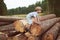 Boy stand near logging