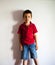 Boy standing against wall