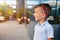 Boy standing near mirror window