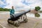 Boy standing near an old cannon in Kronstadt, Russia