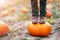 Boy standing on pumpkin