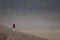 Boy stands on side of Mount Bromo