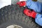 The boy stands at the wheel and touches in red knitted gloves a pattern, snowmobile, quad bike. bad attention driver severe injuri