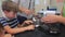 A boy strokes a cat in a veterinary clinic