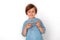 Boy studio standing isolated on grey watching video on smartphone looking camera cheerful