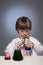 Boy studying a substance in a test tube