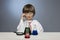 Boy studying a substance in a test tube