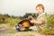 Boy at summer sunset ground