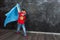 Boy superhero in a blue Cape red mask and a red t-shirt with a star