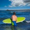 Boy surfer waiting for the waves on the beach