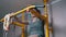 Boy on Swedish Wall Preparing for Pull-ups on Horizontal Bar. Warming up Body