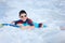 Boy swimming on boogie board