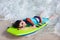 Boy swimming on boogie board