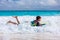 Boy swimming on boogie board