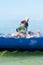 Boy in swimming mask swim in sea with inflatable mattress