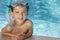 Boy In Swimming Pool With Blue Goggles & Snorkel