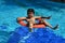 Boy in swimming pool with safety guards