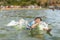 Boy Swimming into the Sea