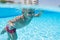 A boy swimming under water