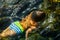 Boy swimming underwater, beautiful view of crystal clear transparent water of sea