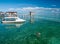 Boy swims on clear crystal ocean