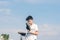 A boy in a T-shirt with sneakers on the sandy Mackenzie beach in Larnaca. Cyprus