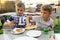 Boy takes Megrelian Khachapuri from plate