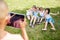 Boy takes photograph of children with tablet