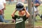 Boy Taking Off Batting Helmet