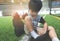 Boy taking shoes off ready for soccer training ground