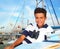 Boy teen sailor laying on marina boat chart map