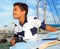 Boy teen sailorsitting on marina boat chart map