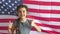 Boy teen shows gesture yes Independence Day American usa flag Fourth of July