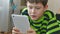 Boy teenage playing on tablet game internet browsing