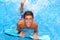 Boy teenager surfboard splashing blue water