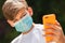 Boy teenager teen male child wearing face mask phone selfie in Coronavirus COVID-19 Pandemic