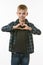 A boy of ten years shows a heart with two hands on his chest