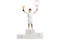 Boy tennis winner standing on a pedestal