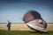 A boy with a tent in the field. Very strong wind, the tent flies away. Flying tent Summer, windy