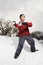 Boy throwing snowball.