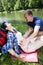 Boy tickling girl by the lake