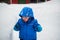 Boy Touching a Deep Snowbank