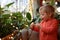 Boy touching lamp garland