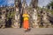 Boy tourist on background of Three stone ladders in beautiful Pura Lempuyang Luhur temple. Paduraksa portals marking