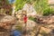 Boy tourist on the Fairy stream among the red dunes, Muine, Vietnam. Vietnam opens borders after quarantine COVID 19