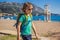 Boy tourist walks along the coast of Budva in Montenegro