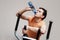 Boy on training apparatus drinks water